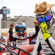 I’m digging the cowboy hat and ex-Le Mans suit look.